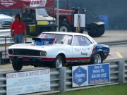White And Blue Camaro Doing Wheelie
